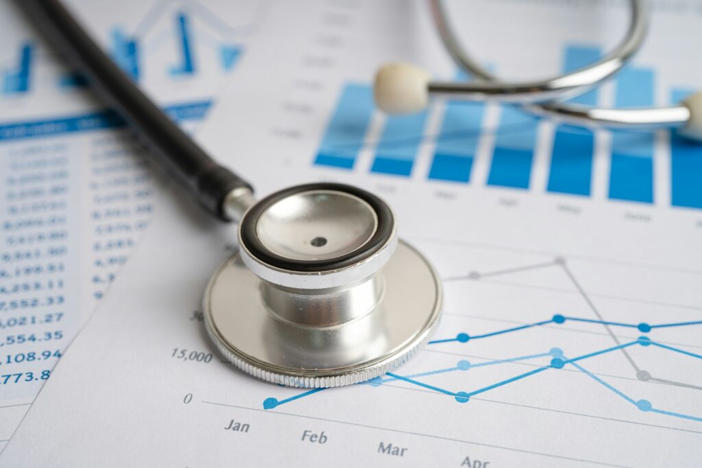 Stethoscope on chart and graph paper, Finance, Account, Statistics, Investment.